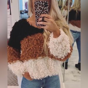 These three boutique sweater